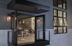 Doors open up to a balcony and windows are tilted open in a modern design supported by Schererville window company.