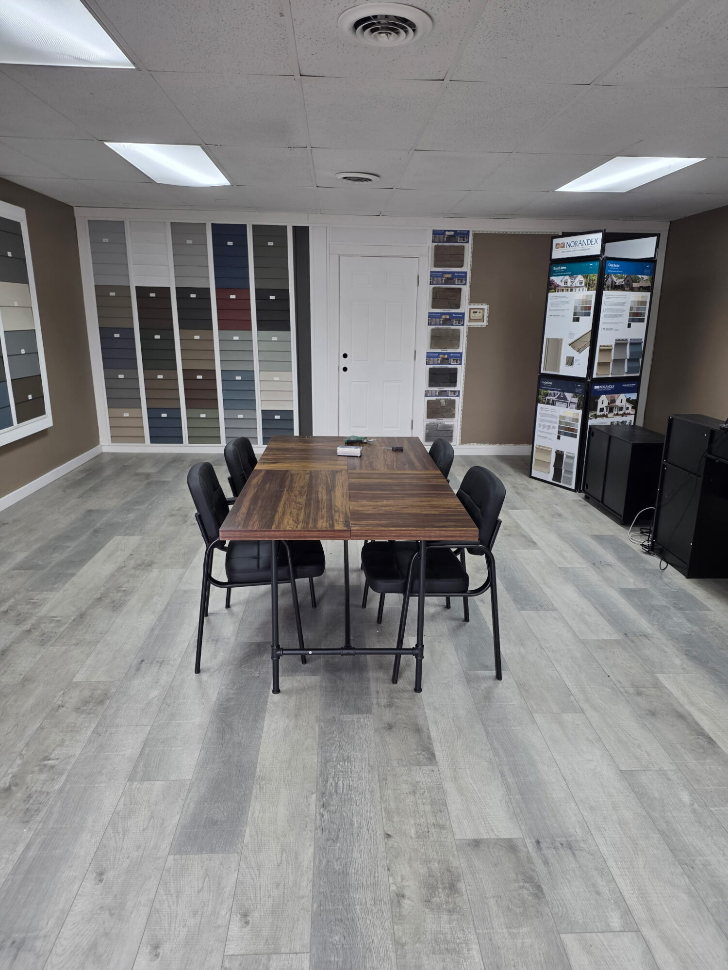 Consultation table and siding and window samples inside the Hammond, IN showroom