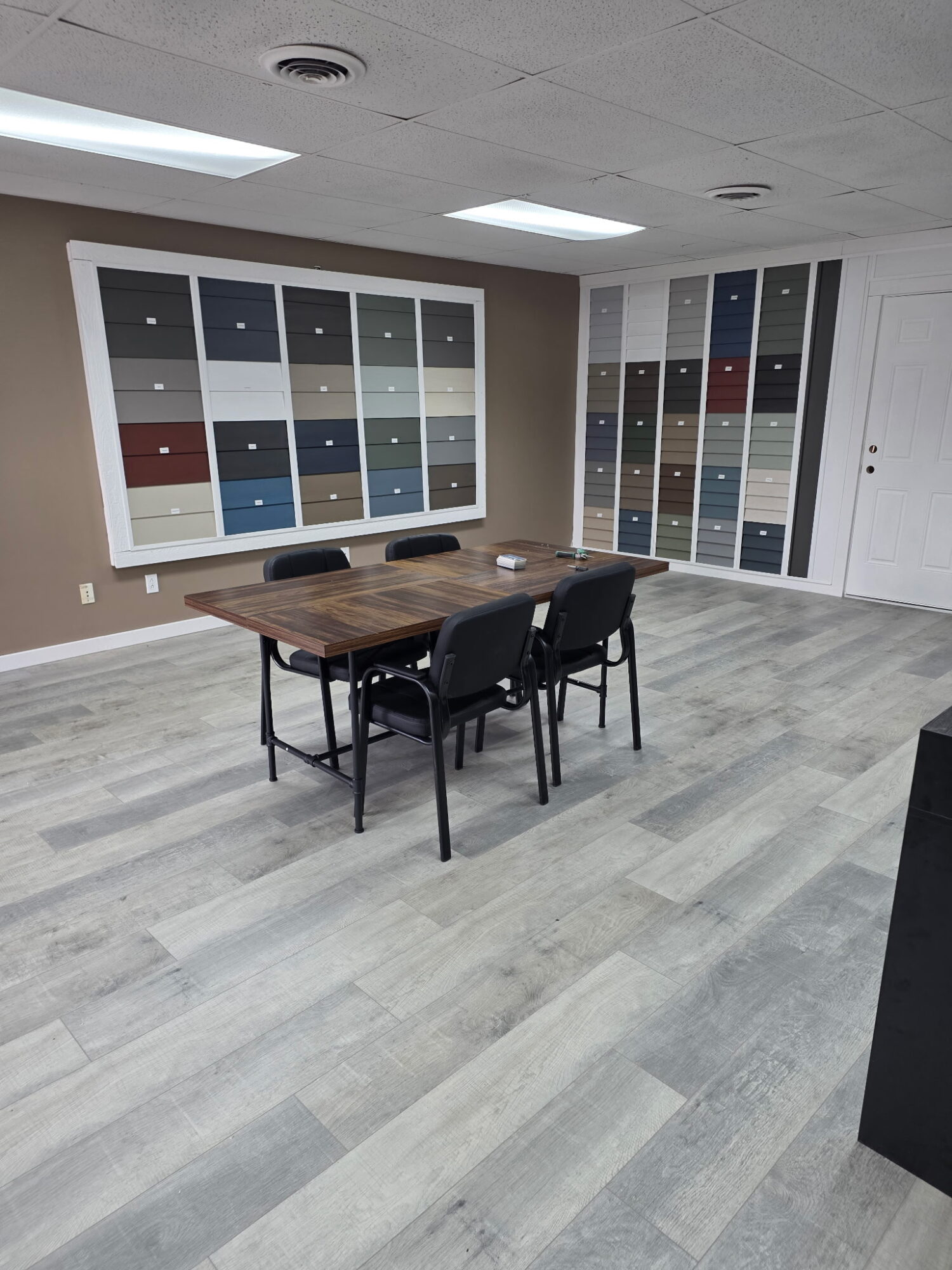 Siding color sample boards on display at the Liberty Siding & Windows showroom in Hammond, IN