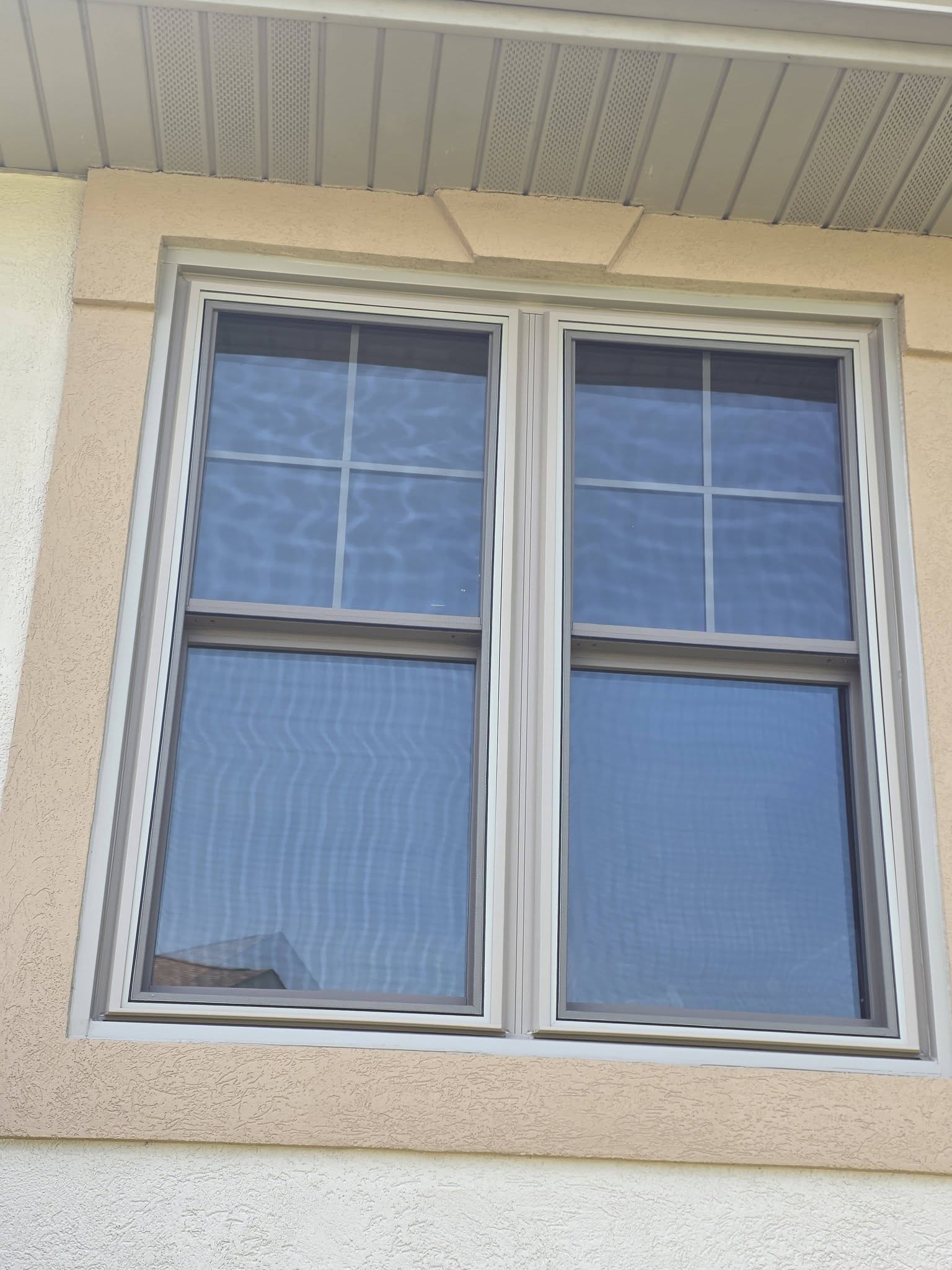After - ProVia Endure double-hung windows with Sandstone exterior trim in Crown Point, IN