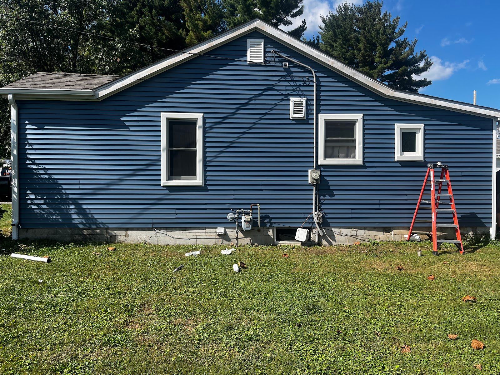 After - Ranch home in Schererville, IN with new blue lap siding and white trim
